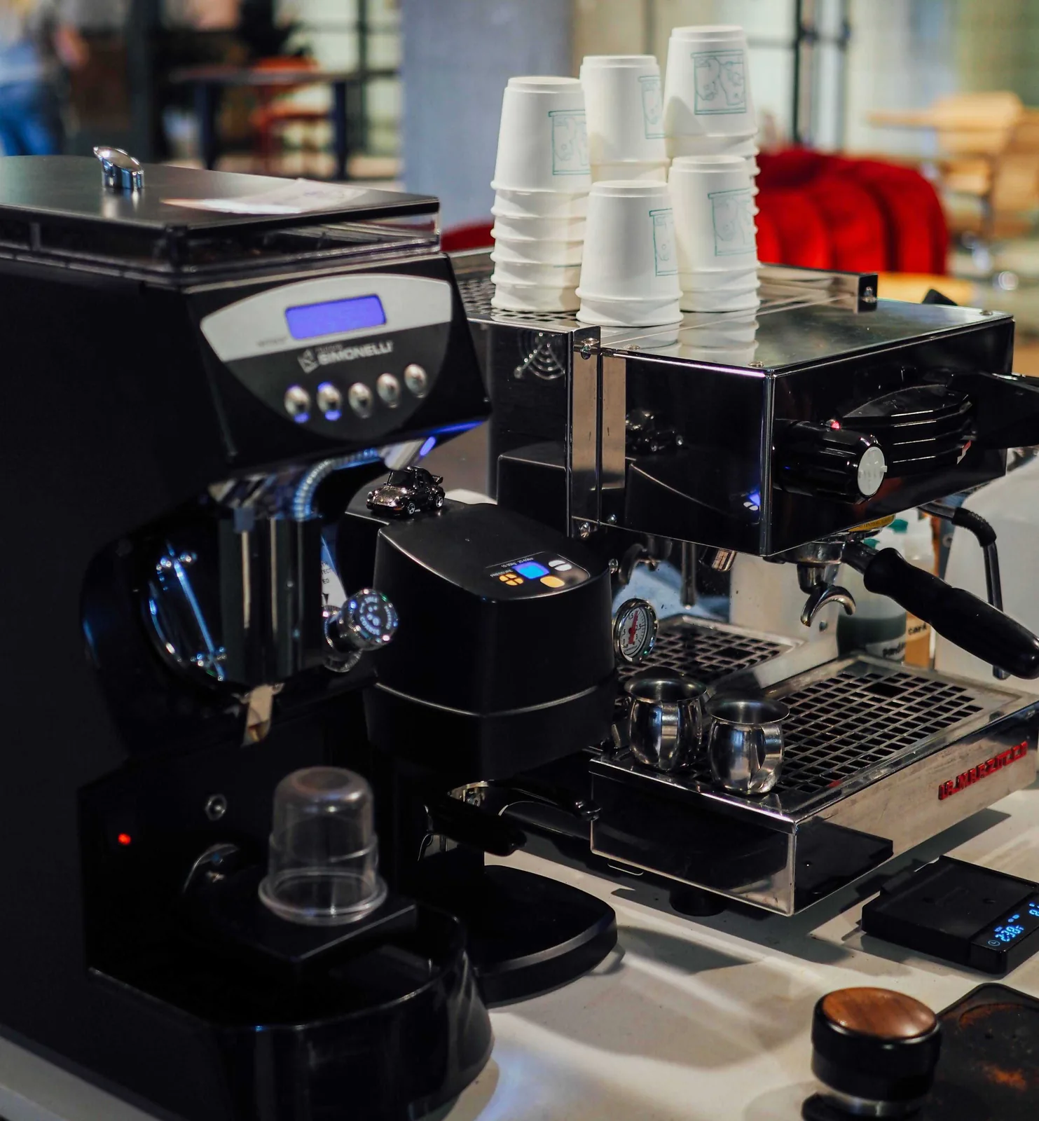 Close-up of the espresso grinder and La Marzocco espresso machine in Paper Son’s mobile catering setup